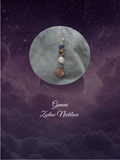 Gemini Zodiac necklace on a textured surface with a starry sky background